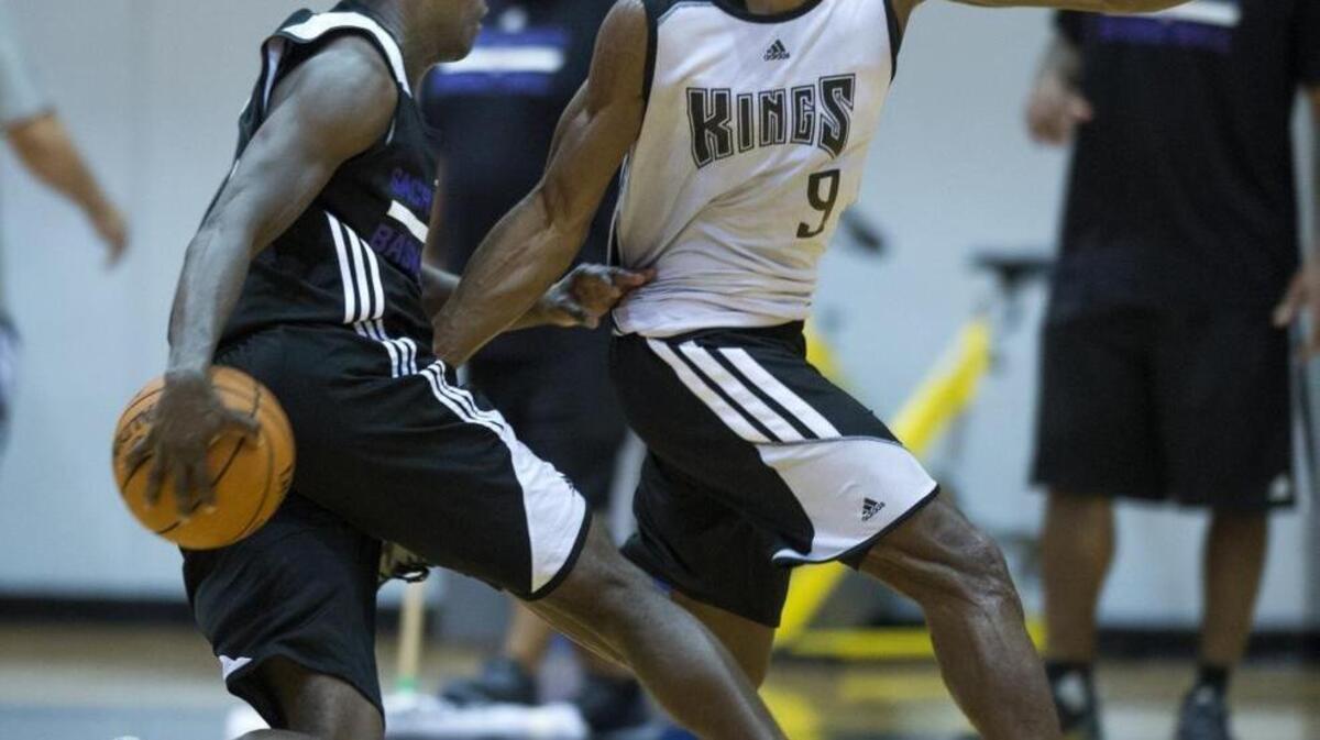 
Kings point guard Darren Collison is defended by teammate and fellow point guard Rajon Rondo during training camp at UC San Diego’s RIMAC Arena on Tuesday, Sept. 29, 2015.

