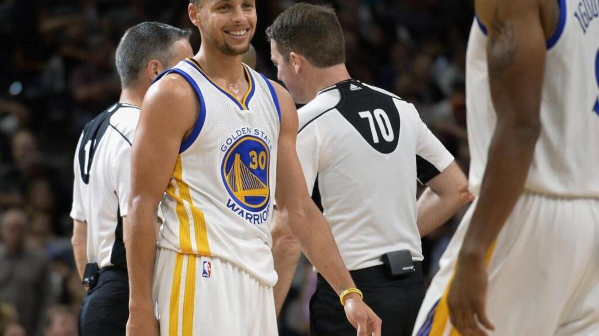 Golden State Warriors guard Stephen Curry looks on during an NBA basketball game against the San Antonio Spurs, Sunday, April 10, 2016, in San Antonio. Curry scored 37 points as Golden State won 92-86.