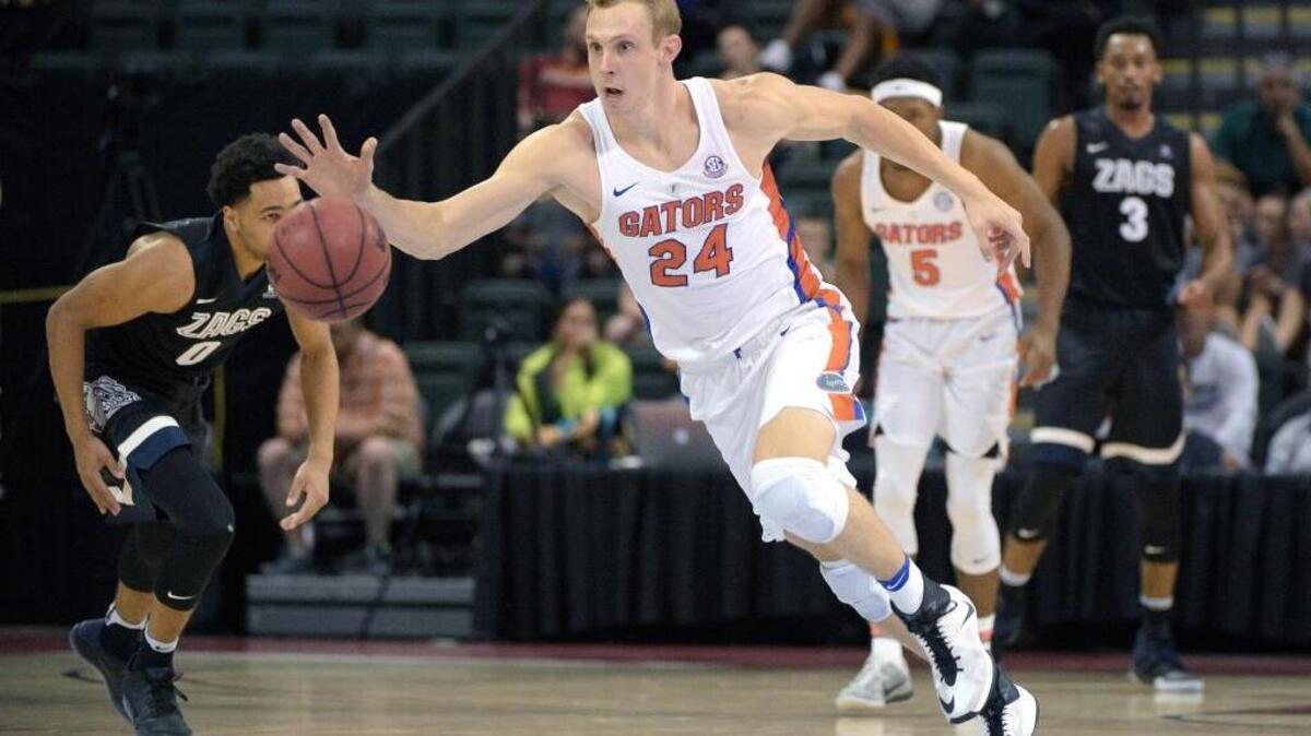 Florida guard Canyon Barry (24) gains control of a loose ball during an NCAA college basketball game against Gonzaga at the AdvoCare Invitational tournament, Friday, Nov. 25, 2016 in Lake Buena Vista, Fla.