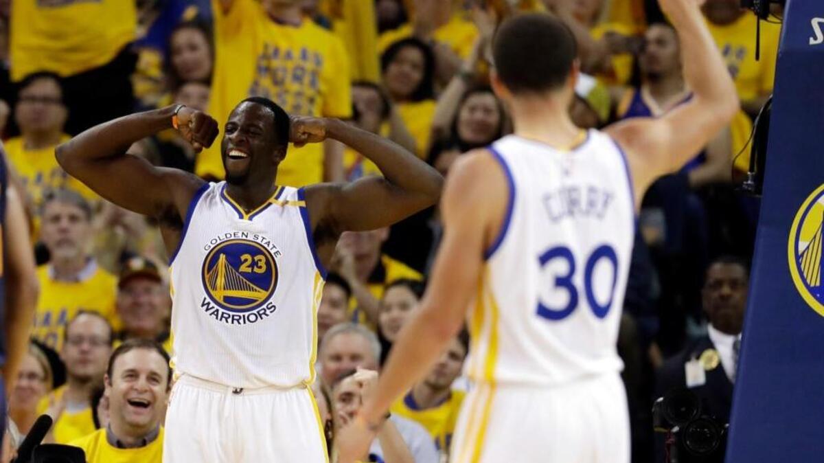 Golden State Warriors forward Draymond Green celebrates during a game against the Utah jazz on May 4 in Oakland. Green and the Warriors are featured on the cover of Sports Illustrated magazine.