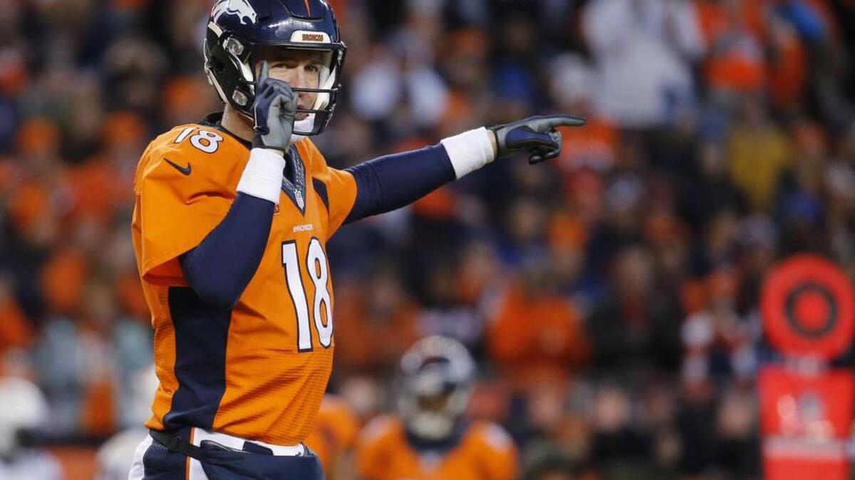 Denver Broncos quarterback Peyton Manning calls the play at the line during the second half in an NFL football game against the San Diego Charger, Sunday, Jan. 3, 2016, in Denver.