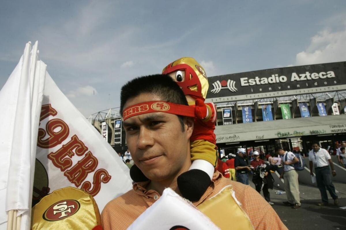 Jose Luis Torres sells 49ers items outside Azteca Stadium on Oct. 2, 2005, in Mexico City. The 49ers played the Arizona Cardinals in the NFL’s first regular-season game outside the United States.