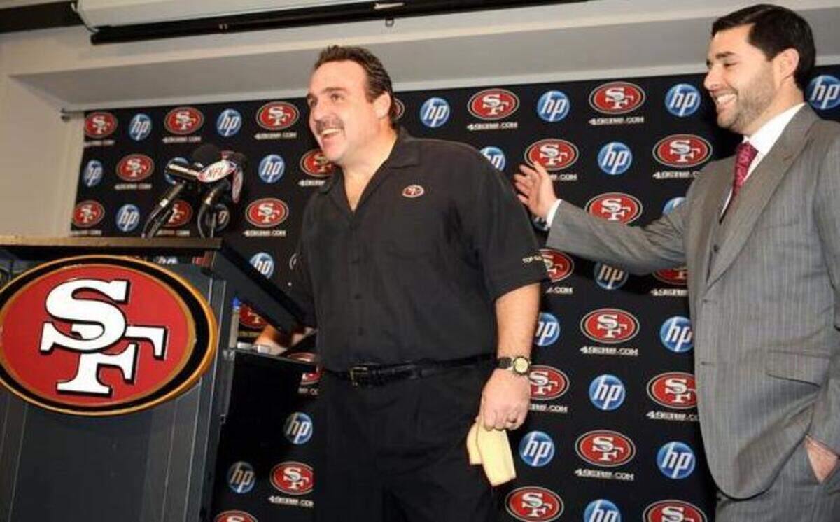 
Jim Tomsula, left, was all smiles when Jed York, right, introduced him as interim head coach after the firing of Mike Singletary in 2010. The happiness might be even more pronounced with Tomsula‘s promotion from defensive line coach to head coach, replacing Jim Harbaugh.
