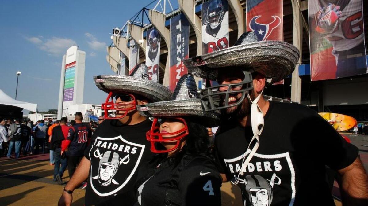 Raiders fans stand outside Azteca Stadium before Oakland plays the Houston Texans on Monday in Mexico City.
