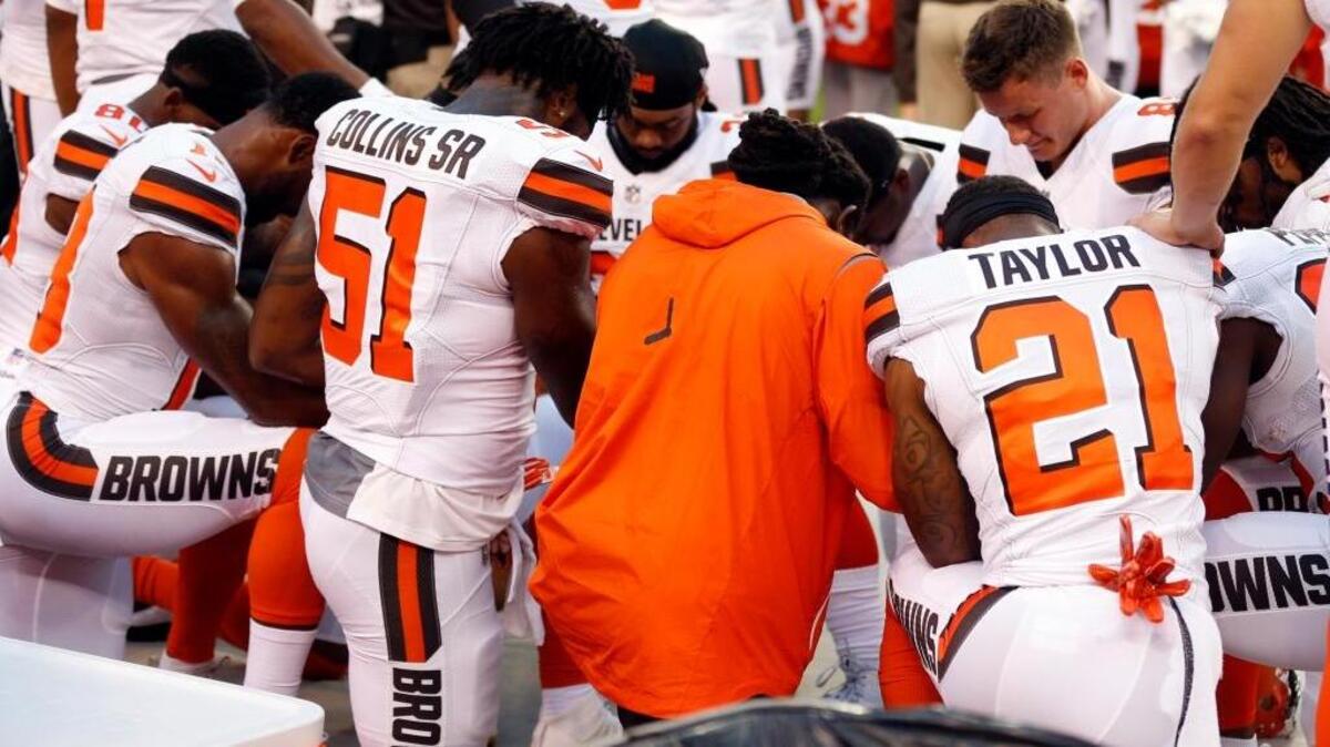 Cleveland Browns players kneel during the national anthem before a preseason game against the New York Giants on Monday in Cleveland.