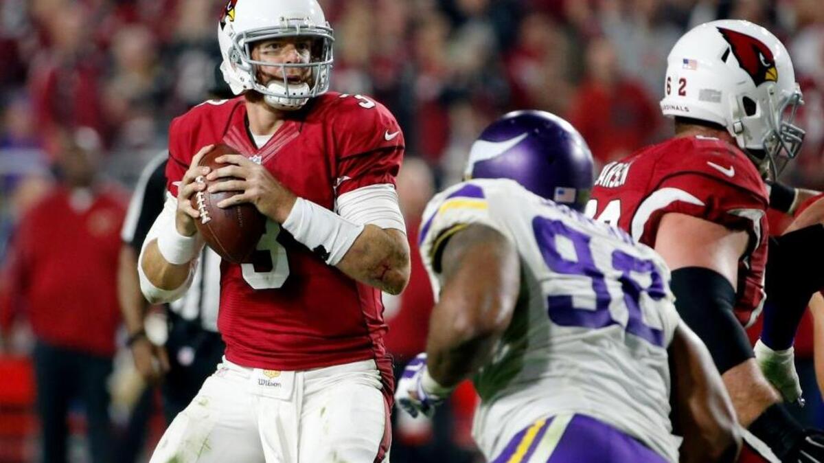 Arizona Cardinals quarterback Carson Palmer looks to pass against the Minnesota Vikings during an NFL football game, Thursday, Dec. 10, 2015, in Glendale, Ariz.