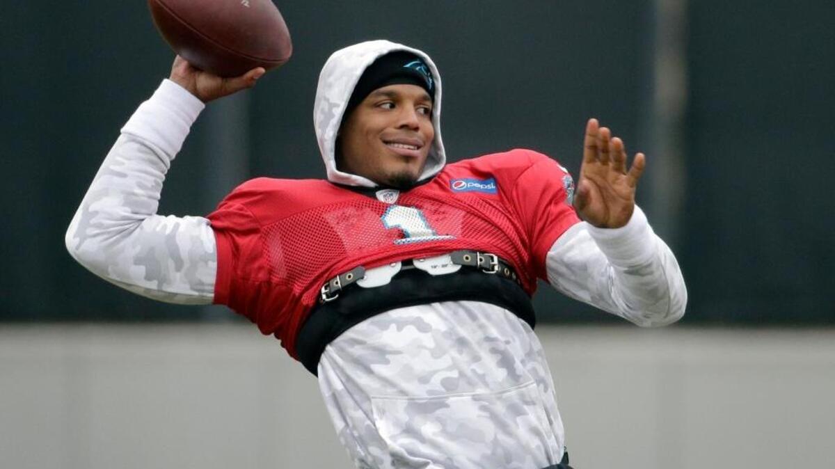 Carolina Panthers' Cam Newton prepares to throw a pass during practice for the NFL football team in Charlotte, N.C., Friday, Jan. 8, 2016.