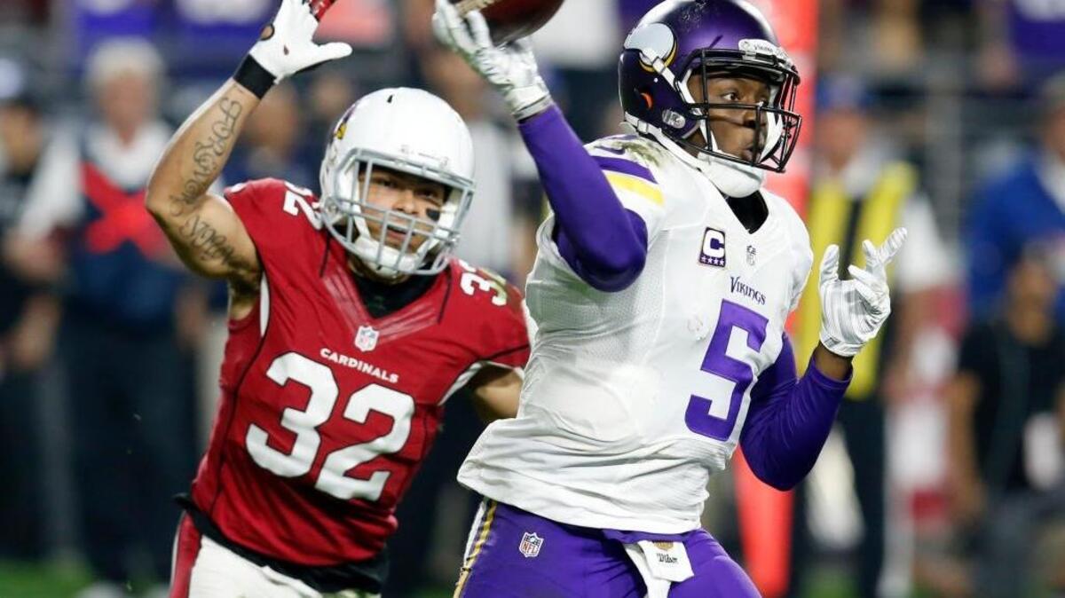 Minnesota Vikings quarterback Teddy Bridgewater throws under pressure from Arizona Cardinals free safety Tyrann Mathieu on Thursday, Dec. 10, 2015, in Glendale, Ariz. Bridgewater threw for 335 yards in a 23-20 loss.