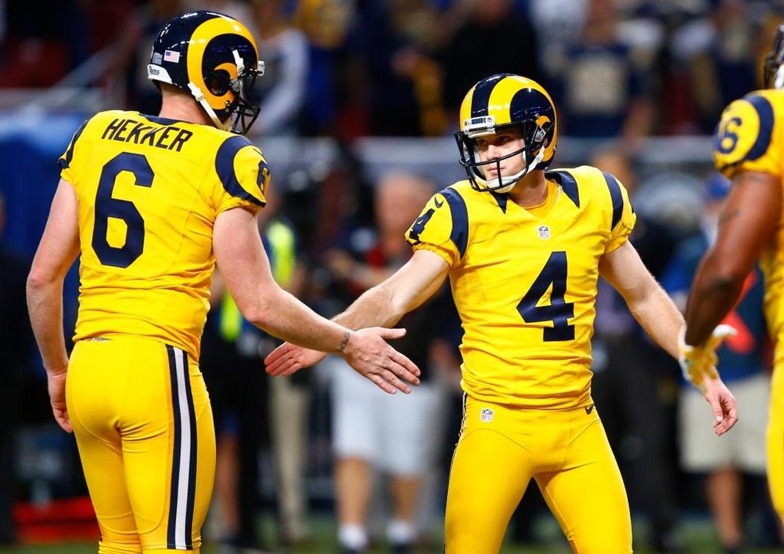 Rams kicker Greg Zuerlein (4) is congratulated by punter Johnny Hekker during a December 2015 game. The team will wear these yellow Color Rush uniforms Thursday when Los Angeles visits the 49ers.
