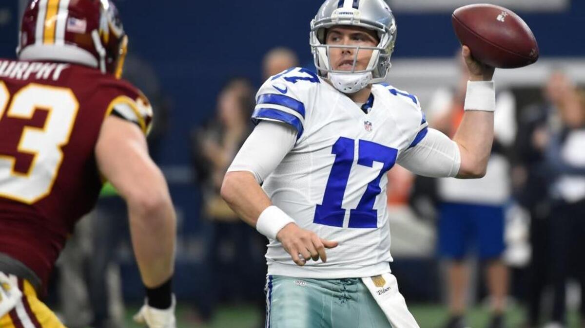 Dallas Cowboys quarterback Kellen Moore (17) prepares to throw as Washington Redskins outside linebacker Trent Murphy pursues Sunday, Jan. 3, 2016, in Arlington, Texas.