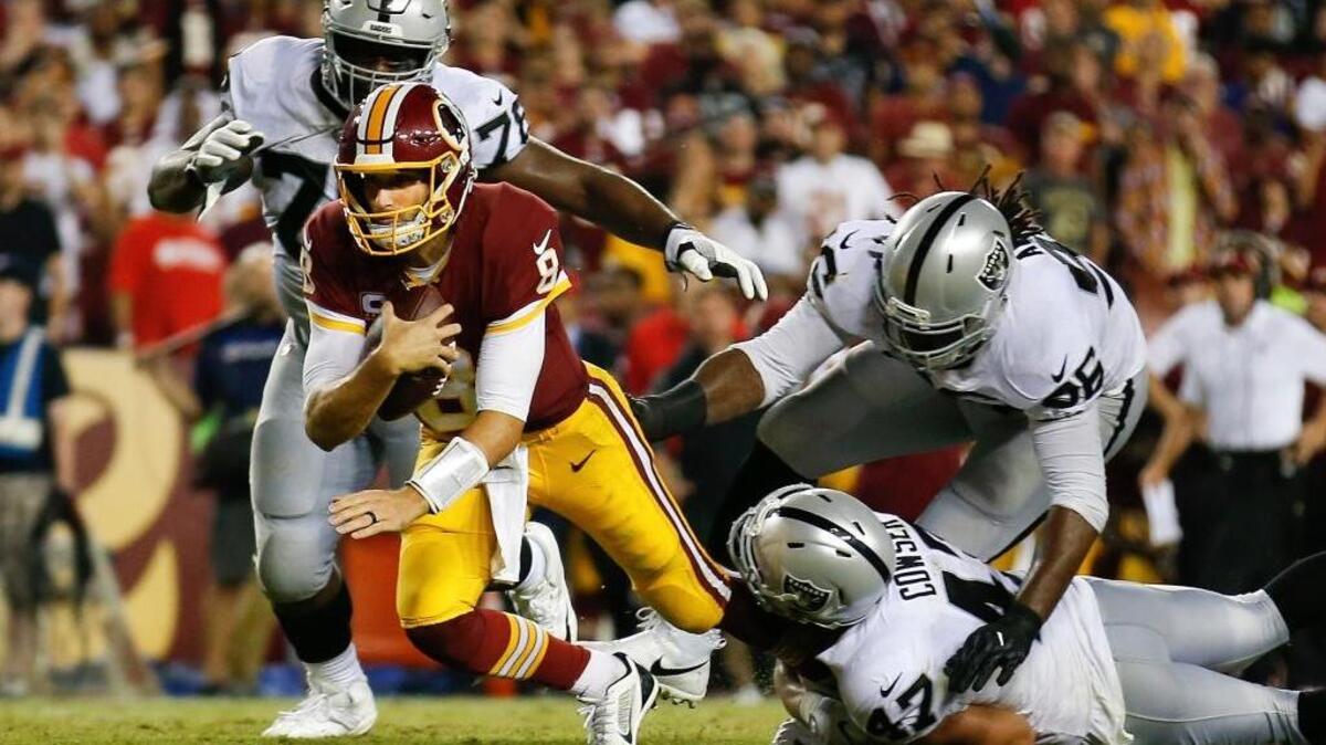 The Raiders couldn’t contain Washington Redskins quarterback Kirk Cousins (8) in Sunday’s 27-10 loss in Landover, Md.