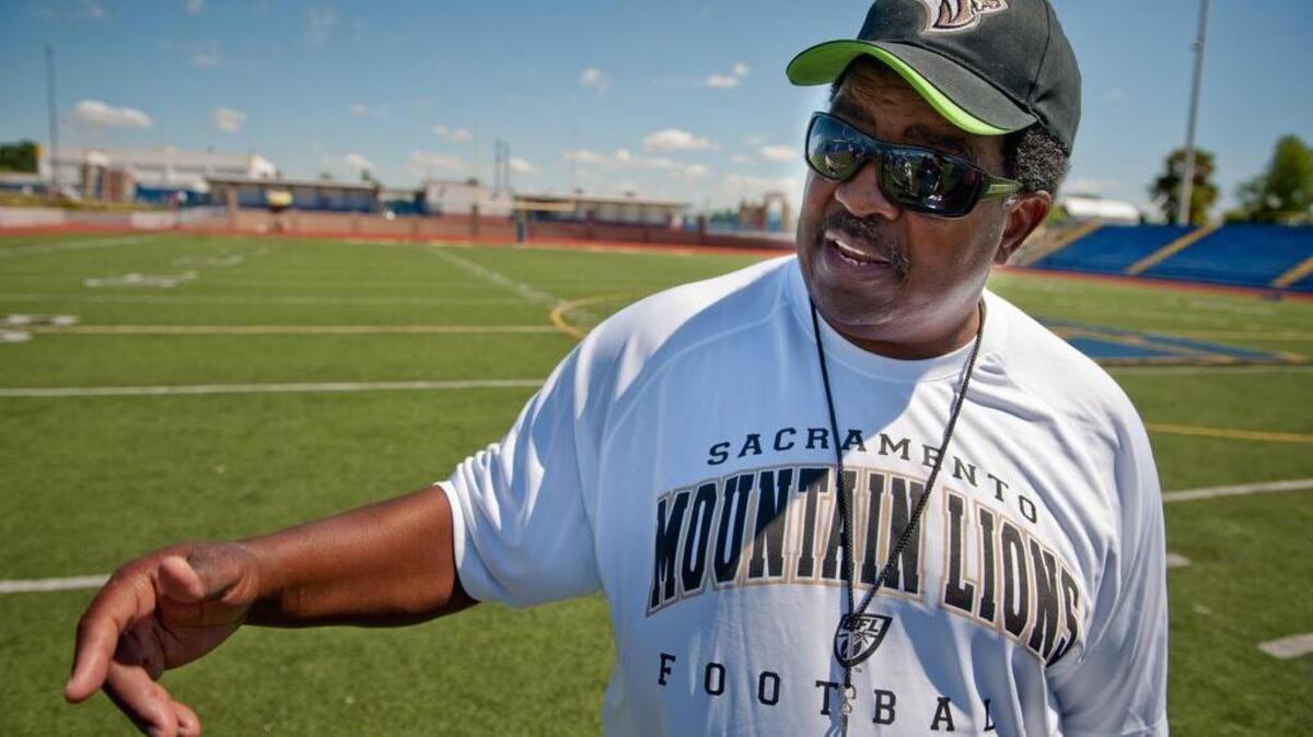 Coach Dennis Green talks to the local media after the Sacramento Mountain Lions’ first mini-camp of the offseason, on June 4, 2010, at Grant High School football field in Sacramento.