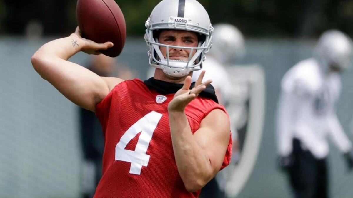 Raiders quarterback Derek Carr throws at the team’s training facility May 30 in Alameda.