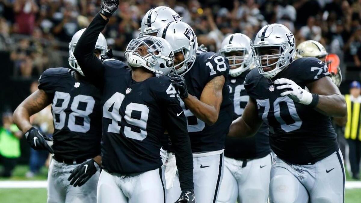 Jamize Olawale (49) and his Oakland Raiders teammates celebrate during an NFL football game against the New Orleans Saints in New Orleans on Sunday, Sept. 11, 2016. The Raiders won 35-34 and look to continue their winning ways against another NFC South opponent, the Atlanta Falcons, on Sunday, Sept. 18, in Oakland.