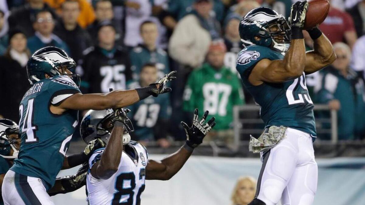 
Nate Allen, right, intercepts a pass against the Carolina Panthers Nov. 10, 2014, in Philadelphia. He had a career-best four interceptions last season.
