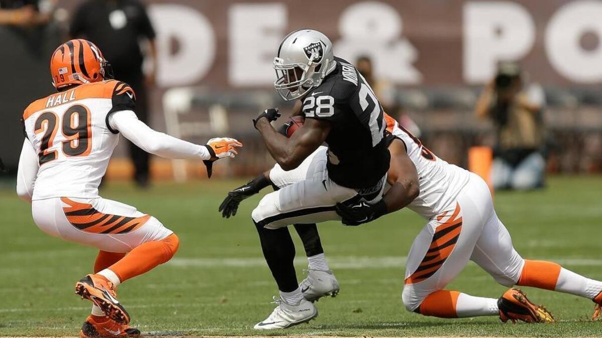 
Latavius Murray (28) finds little room to run last week against the Bengals, who held the Raiders to 61 rushing yards on 16 attempts. Murray rushed for 44 yards on 11 carries.
