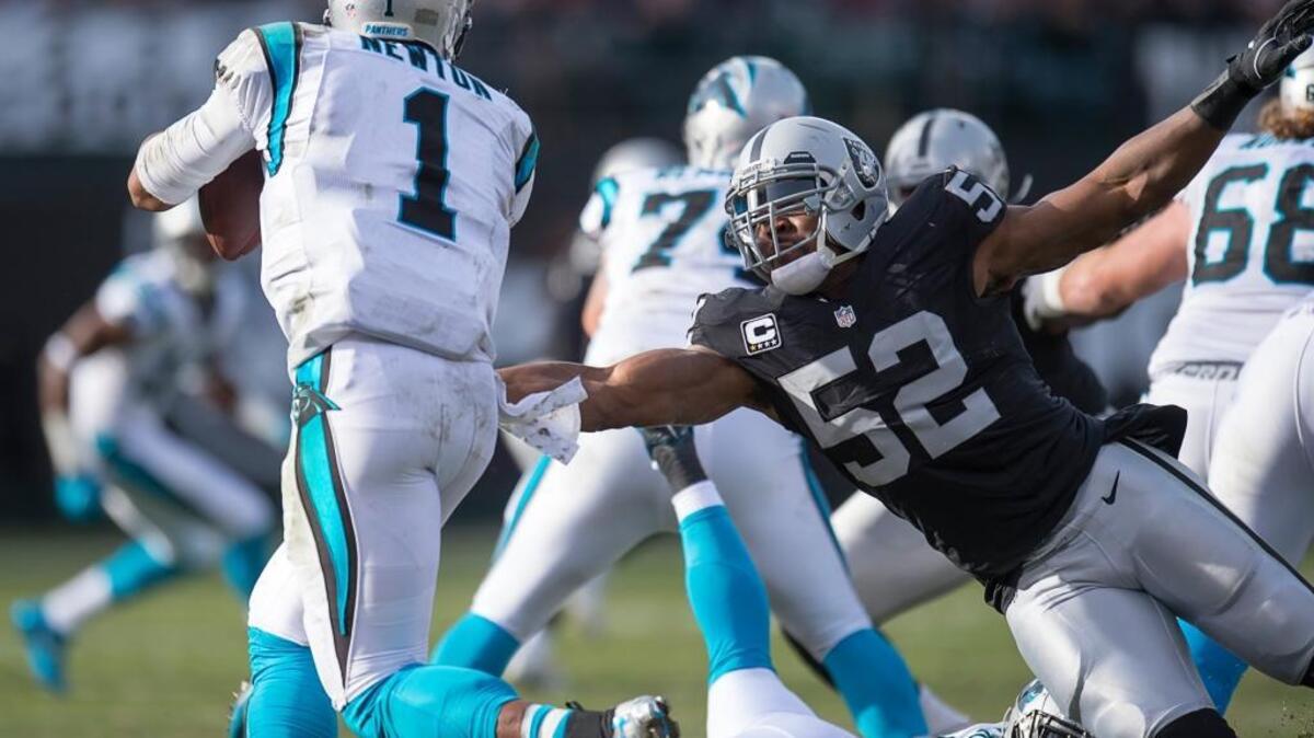 Raiders defensive end Khalil Mack (52) puts some heat on Carolina quarterback Cam Newton in a Nov. 27, 2016 game in Oakland, Calif.