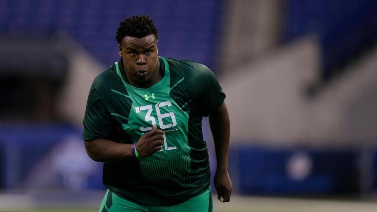 
Florida defensive lineman Leon Orr runs a drill at the NFL scouting combine in Indianapolis, Sunday, Feb. 22, 2015. Orr left the Gators midway through the season and experts question his strength and technique.
