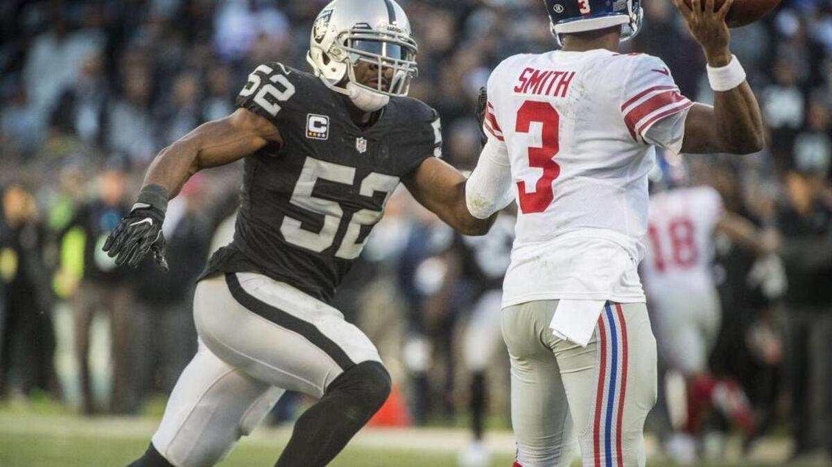 Oakland Raiders defensive end Khalil Mack (52) pressures New York Giants quarterback Geno Smith (3) at the Coliseum on Sunday, Dec. 2, 2017 in Oakland, Calif.