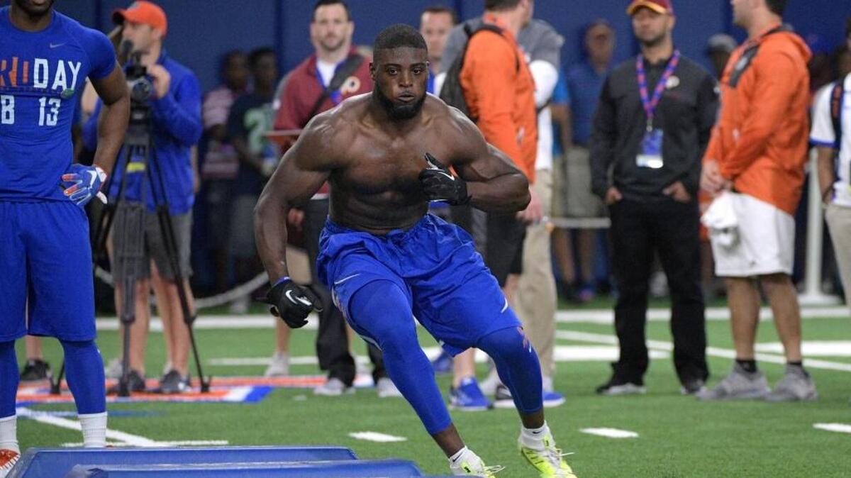 Linebacker Jarrad Davis runs through a drill during Florida’s NFL Pro Day in Gainesville, Fla., on March 28. Four analysts in this mock draft roundup have Davis going to the Raiders with the 24th pick.