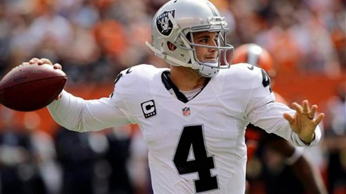 
Oakland Raiders quarterback Derek Carr throws in the first half against the Cleveland Browns.
