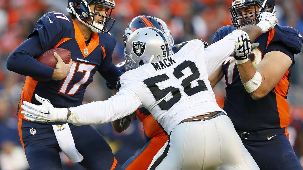 Oakland Raiders defensive end Khalil Mack fights off two Denver offensive linemen to get to quarterback Brock Osweiler for the sack during the second half on Sunday, December 13, 2015, in Denver. Mack is one of seven members of the Oakland Raiders to be selected to the AFC roster of the 2017 Pro Bowl on December 20, 2016.