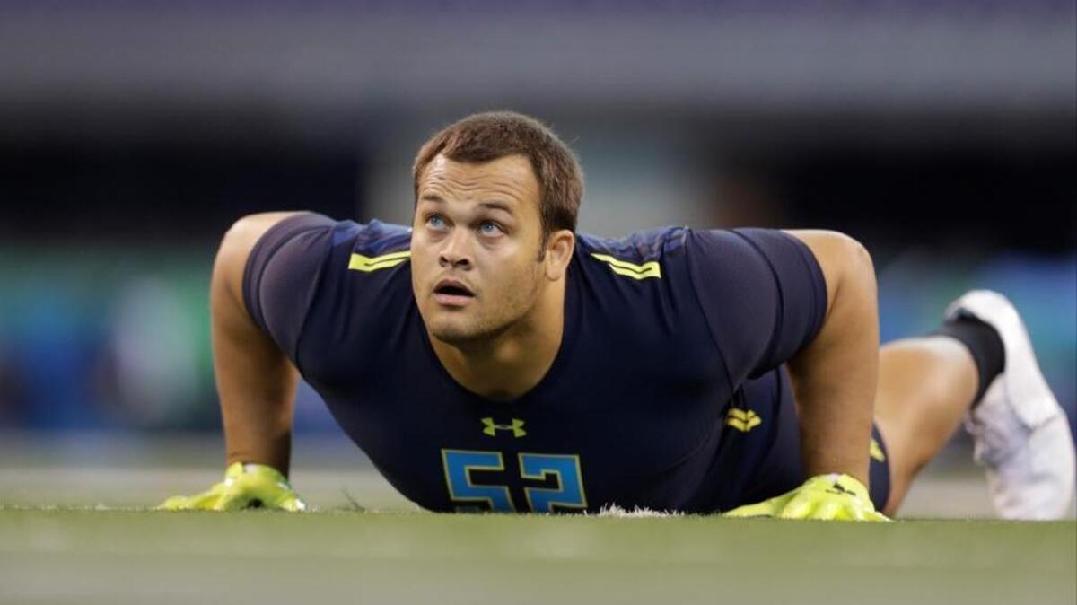 UCLA defensive lineman Eddie Vanderdoes runs a drill at the NFL scouting combine on March 5 in Indianapolis. The Placer High graduate is expected to be drafted in the early rounds.