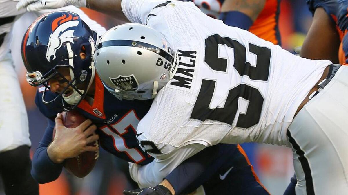 The Raiders’ Khalil Mack sacks Broncos quarterback Brock Osweiler in the second half of a game Sunday, Dec. 13, 2015, in Denver.