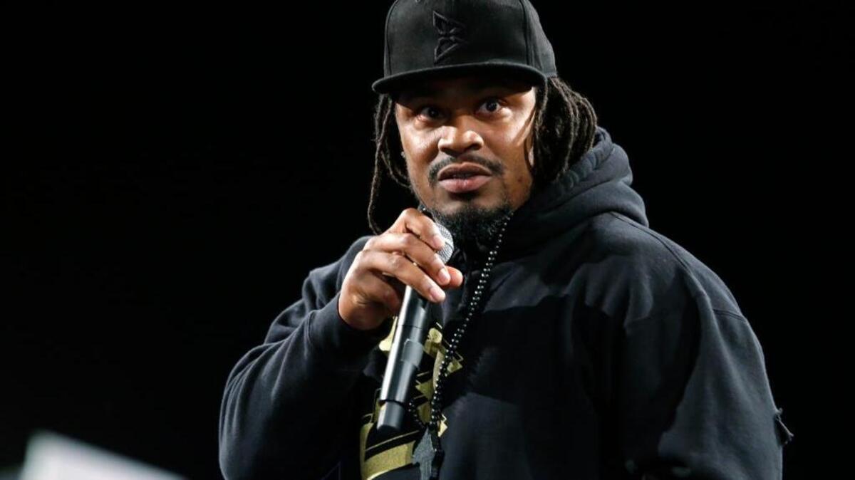 NFL running back Marshawn Lynch speaks Thursday, May 5, 2016, at a job fair in Seattle sponsored by the 100,000 Opportunities Initiative. Sources reported Thursday that Lynch plans to come out of retirement and is negotiating a trade to the Raiders.