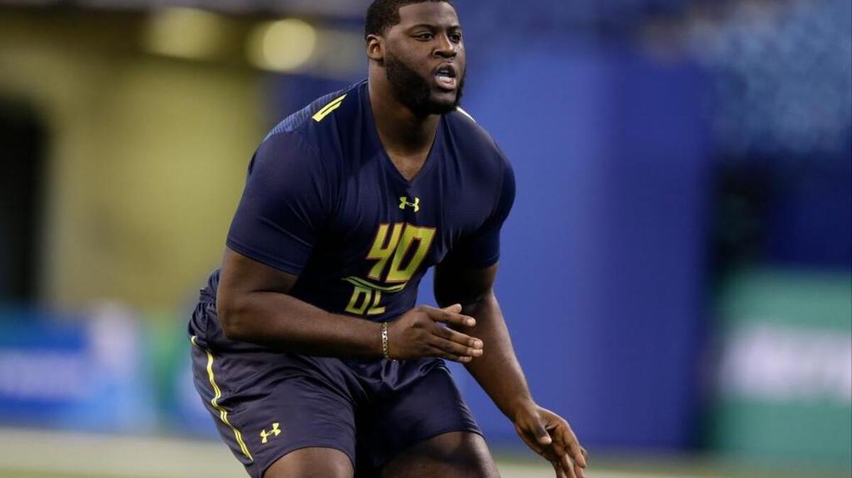 Florida offensive lineman David Sharpe runs a drill at the scouting combine in Indianapolis on March 3.