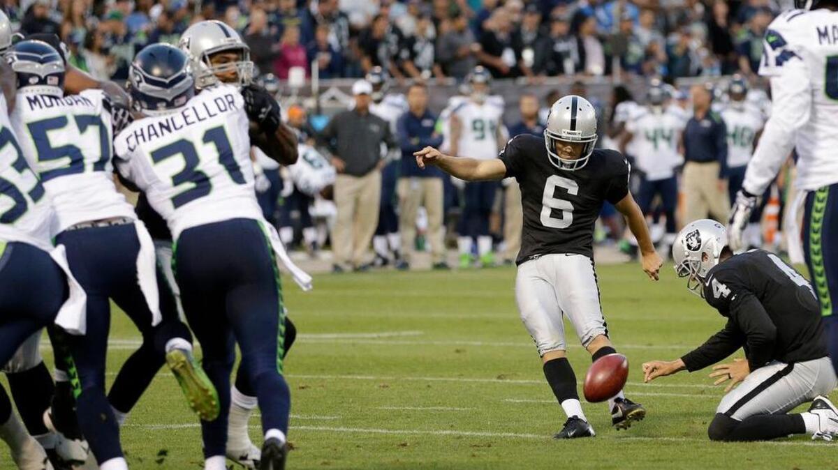 
A week after kicking for the Detroit Lions, Giorgio Tavecchio kicks an extra point against the Seattle Seahawks in an exhibition game, Aug. 28, 2014.

