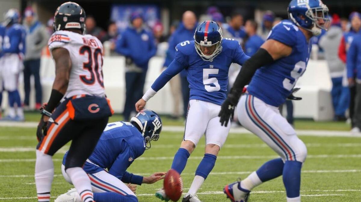 New York Giants kicker Robbie Gould (5) kicks an extra point against the Chicago Bears during the third quarter of an NFL football game, Sunday, Nov. 20, 2016, in East Rutherford, N.J. Gould missed two extra-point attempts against his former longtime team but the Giants still won 22-16.