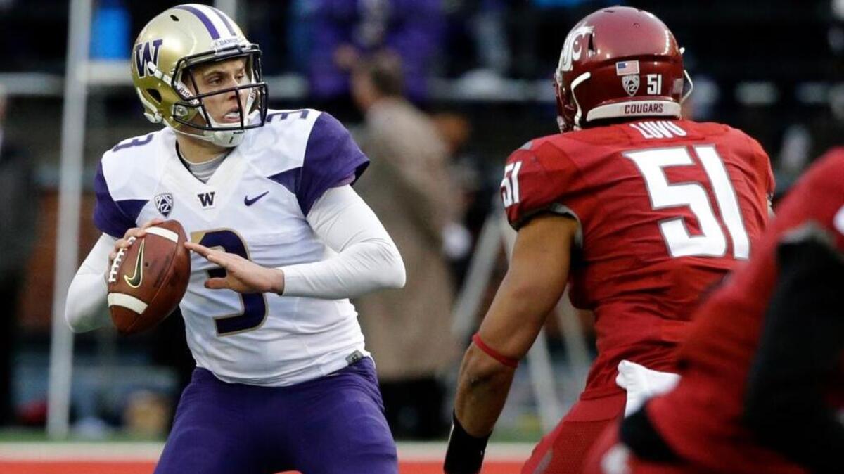 Washington quarterback Jake Browning reportedly underwent shoulder surgery. ... Browning passes under pressure from linebacker Frankie Luvu during an NCAA college football game, Friday, Nov. 25, 2016, in Pullman, Wash. Washington beat Washington State 45-17.