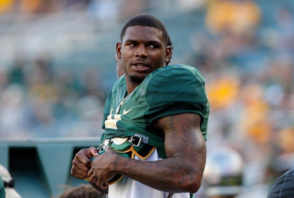 Baylor wide receiver KD Cannon (9) stands on top of a bench watching play against Kansas during an NCAA college football game, Saturday, Oct. 15, 2016, in Waco, Texas.