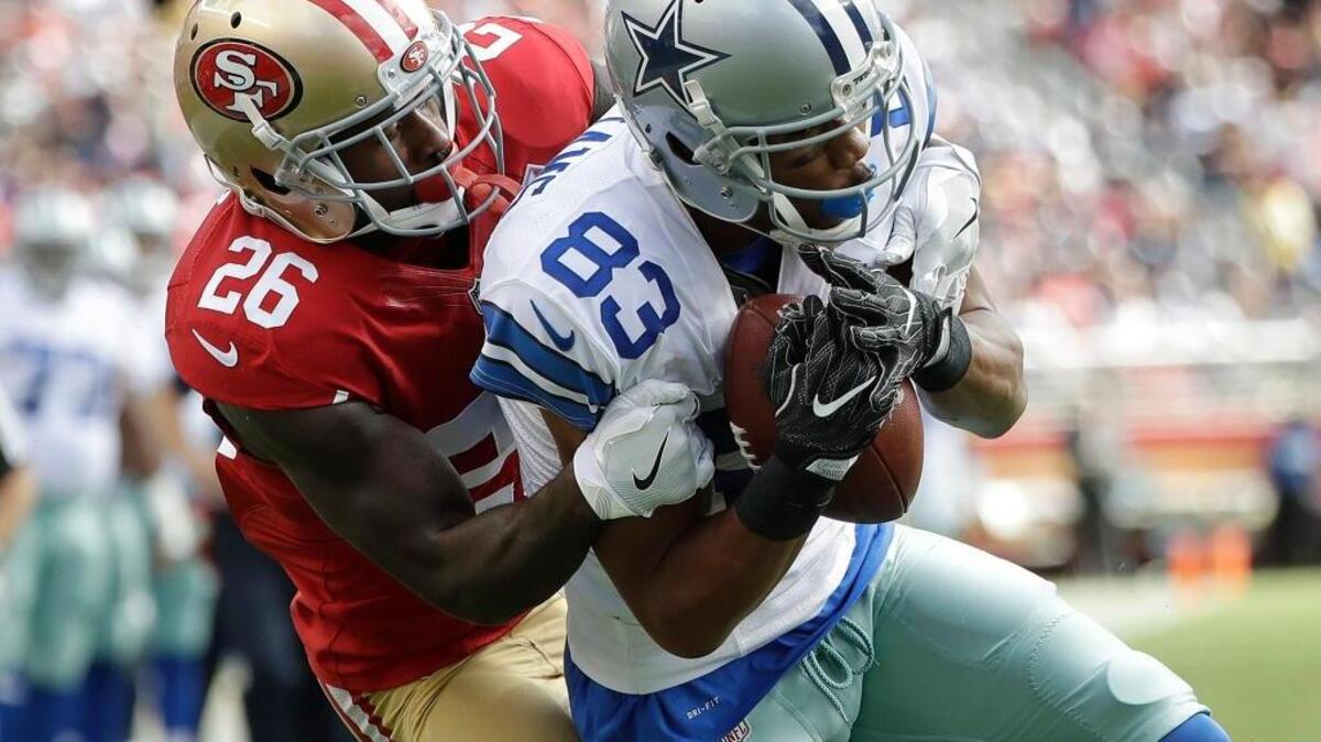 49ers cornerback Tramaine Brock, left, can’t stop Dallas Cowboys wide receiver Terrance Williams from scoring a touchdown on Oct. 2 at Levi’s Stadium in Santa Clara. Brock was released by the 49ers last week following a domestic violence arrest.