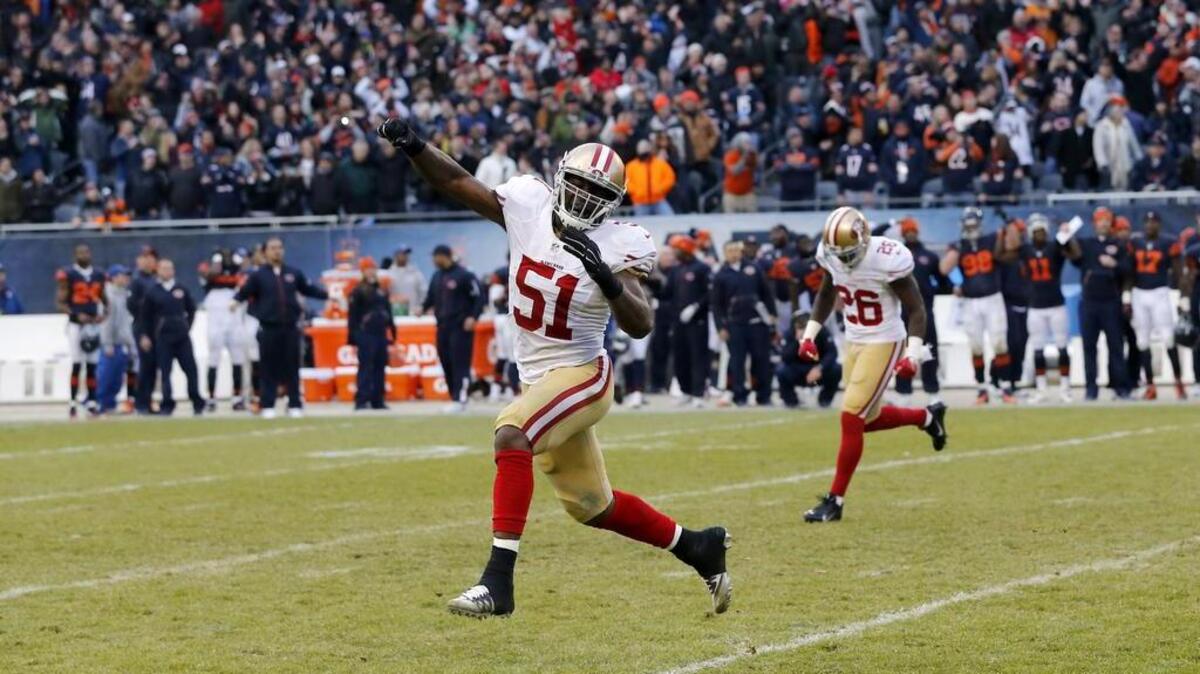 San Francisco 49ers middle linebacker Gerald Hodges (51) celebrates after Chicago Bears kicker Robbie Gould (9) misses a field goal during the second half of an NFL football game, Sunday, Dec. 6, 2015, in Chicago.