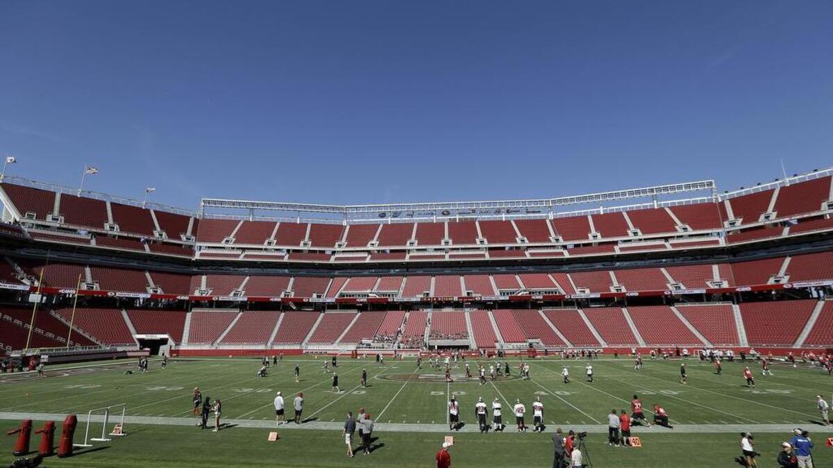 
San Francisco 49ers players run at Levi's Stadium during the team's NFL football training camp in Santa Clara, Calif., Sunday, Aug. 2, 2015.
