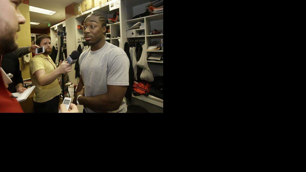 
San Francisco 49ers running back Marcus Lattimore speaks to reporters in the locker room at an NFL training facility in Santa Clara, Calif., Monday, Jan. 20, 2014.
