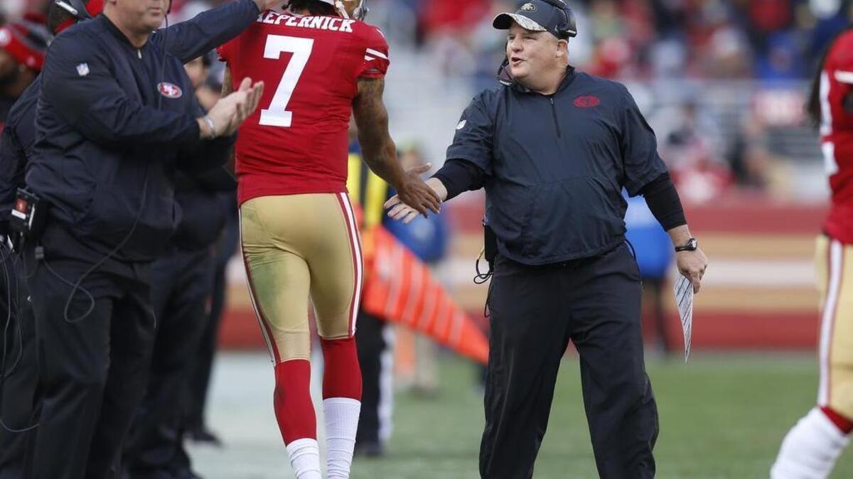 Chip Kelly celebrates with quarterback Colin Kaepernick after the 49ers scored a touchdown against Seattle in the second quarter at Levi's Stadium in Santa Clara, Calif., on Sunday, Jan. 1, 2017. The Seahawks won the regular-season finale, 25-23.