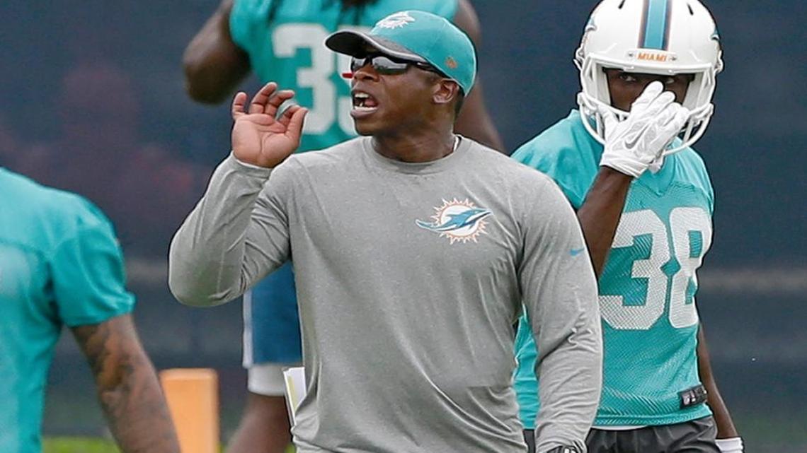 FILE - In this June 6, 2016, file photo, Miami Dolphins defensive coordinator Vance Joseph gives instructions, as cornerback Chimdi Chekwa (38) looks on during practice at the team's NFL football training facility, in Davie, Fla.