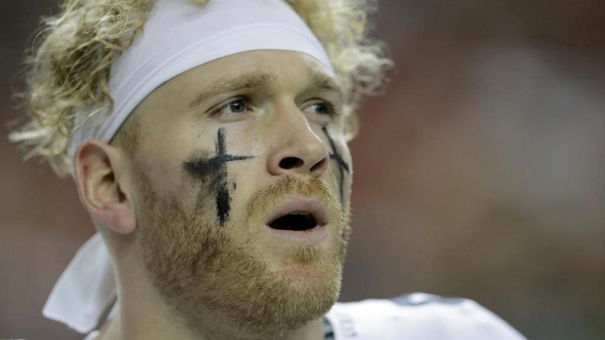 Seattle Seahawks outside linebacker Cassius Marsh (91) sings the national anthem before the first half of an NFL football NFC divisional playoff game between the Atlanta Falcons and the Seattle Seahawks, Saturday, Jan. 14, 2017, in Atlanta.