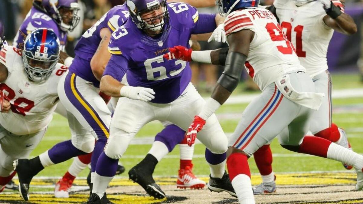 Minnesota Vikings guard Brandon Fusco (63) looks to block New York Giants defensive end Jason Pierre-Paul, right, during the first half of an NFL football game Monday, Oct. 3, 2016, in Minneapolis.