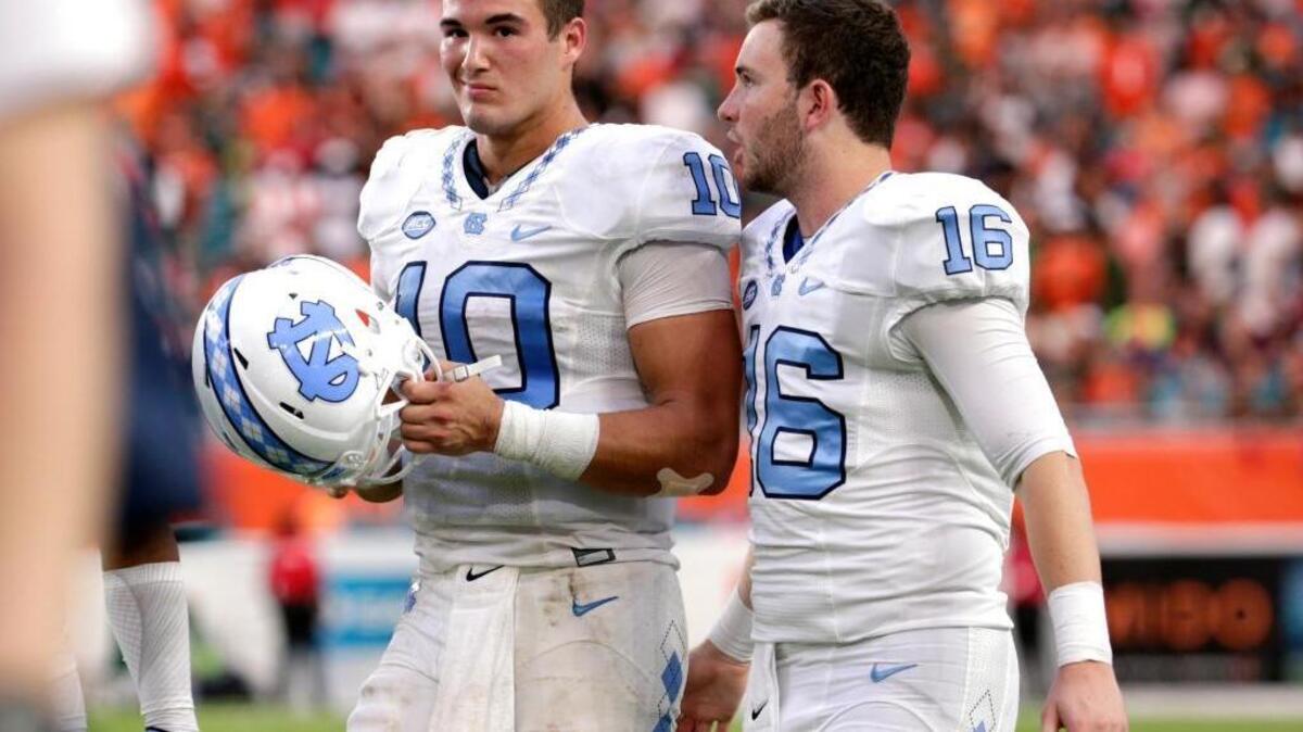 North Carolina quarterback Mitch Trubisky (10)safety Stephen Albright (16) during the second half of an NCAA college football game against Miami, Saturday, Oct. 15, 2016, in Miami Gardens, Fla. North Carolina defeated Miami 20-13.