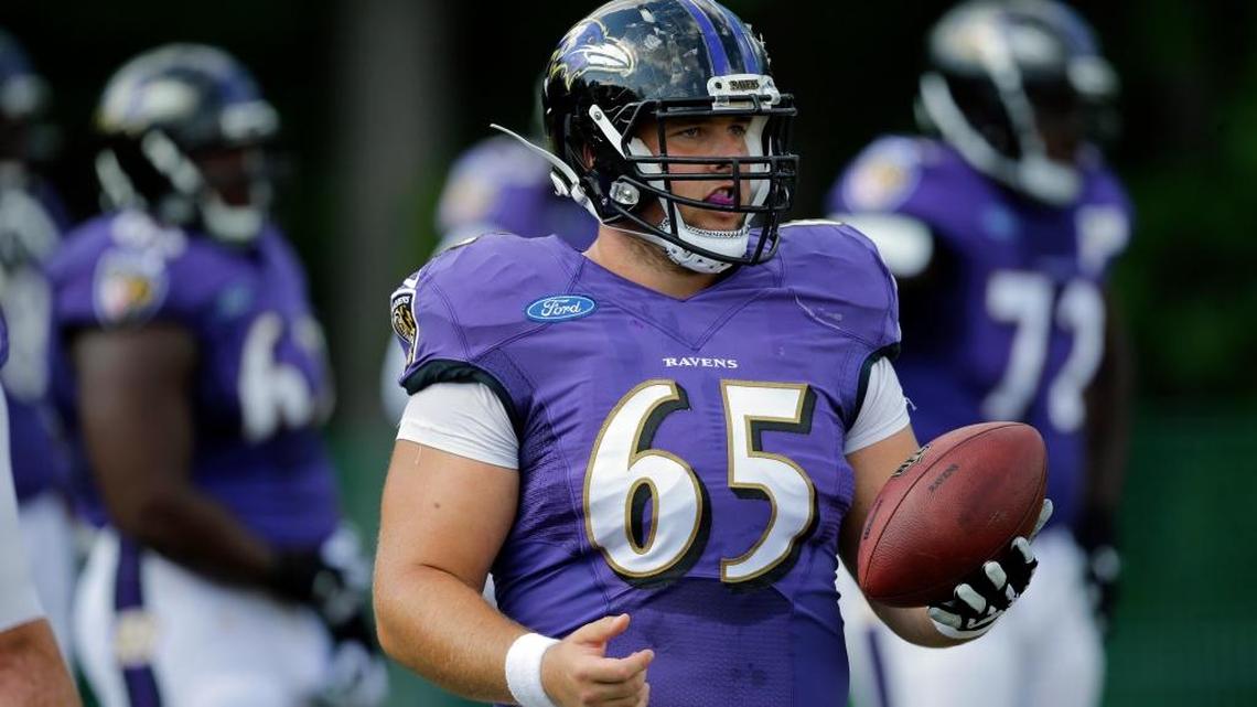 
Baltimore Ravens center Nick Easton (65) walks on the field during NFL football training camp, Saturday, Aug. 8, 2015, in Owings Mills, Md. 
