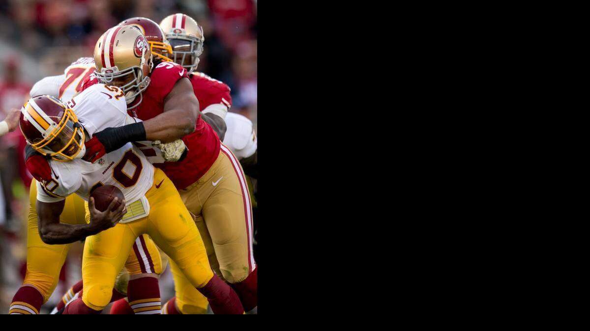 
Ray McDonald, shown here sacking Washington quarterback Robert Griffin Jr., became a free agent when the 49ers released him in December.
