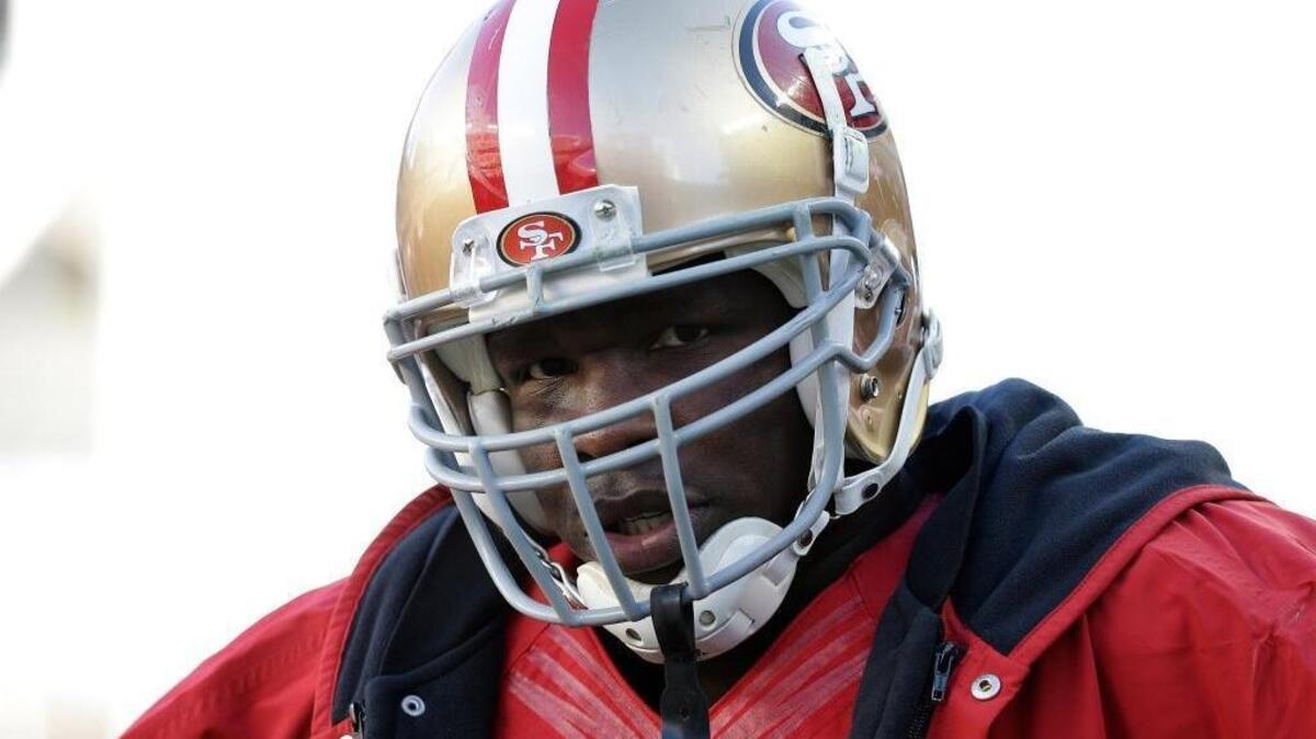 San Francisco 49ers running back Frank Gore (21) stands on the sideline during the third quarter of an NFL football game against the Arizona Cardinals in Santa Clara, Calif., Sunday, Dec. 28, 2014.
