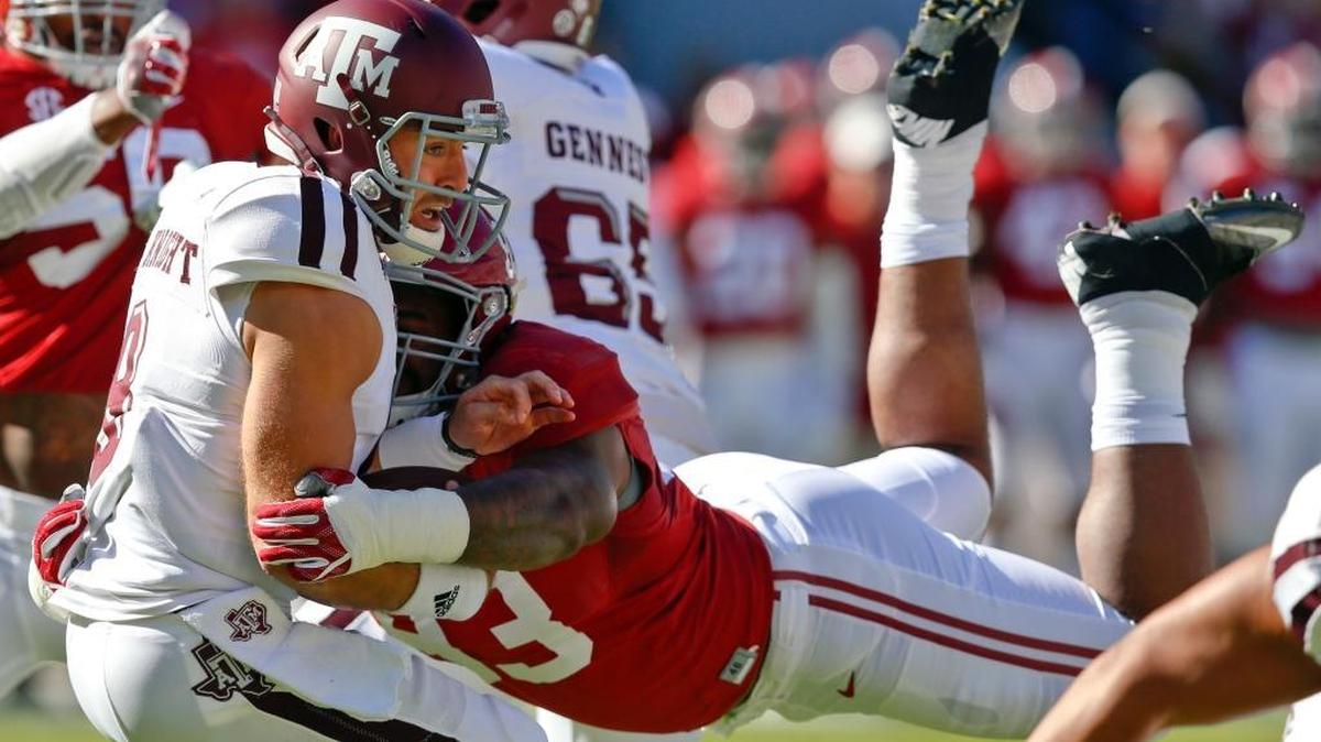 In this Oct. 22, 2016, file photo, Alabama defensive lineman Jonathan Allen (93) sacks Texas A&M quarterback Trevor Knight during the first half of an NCAA college football game,in Tuscaloosa, Ala. The Southeastern Conference's two stingiest defenses will take the field in the league championship game.
