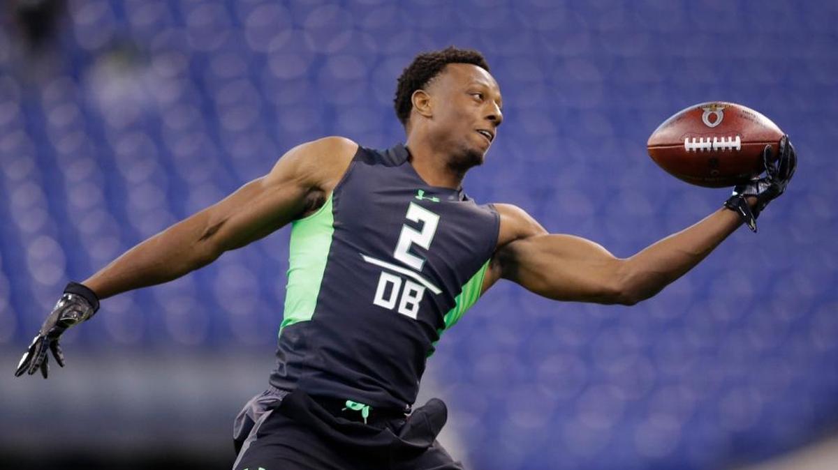 Ohio State defensive back Eli Apple Makes a catch as he runs a drill at the NFL football scouting combine in Indianapolis, Monday, Feb. 29, 2016.