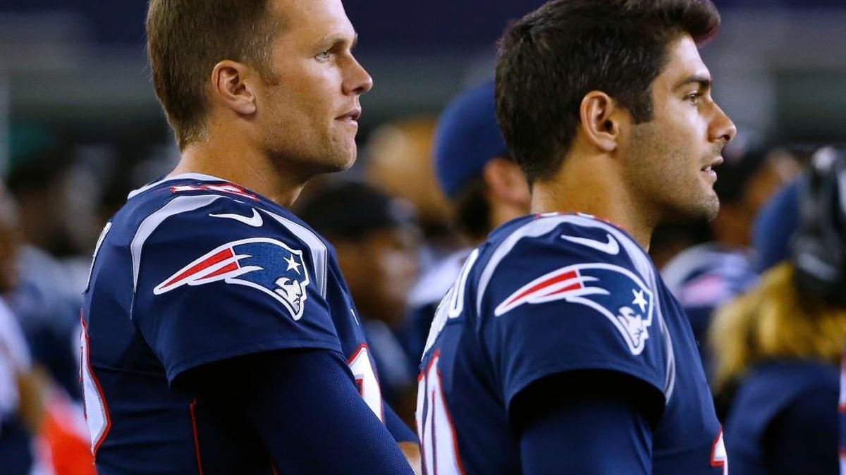 FILE - In this Thursday, Aug. 31, 2017 file photo, New England Patriots quarterback Tom Brady, left, and quarterback Jimmy Garoppolo wach from the sideline on during the second half of an NFL preseason football game against the New York Giants in Foxborough, Mass. On Monday, Oct. 30, 2017, the Patriots traded Garoppolo to the San Francisco 49ers for a 2018 draft pick.