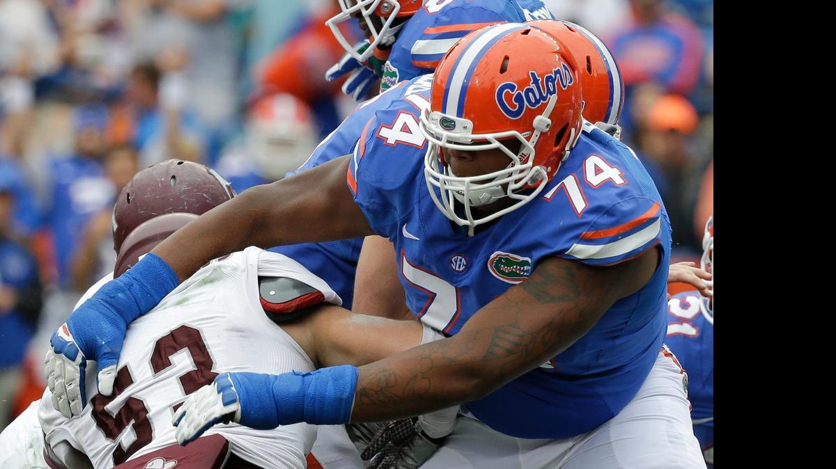 
Florida's Trenton Brown (74) blocks Eastern Kentucky linebacker Jeffrey Canady (53) during the first half of an NCAA college football game in Gainesville, Fla., Saturday, Nov. 22, 2014. 
